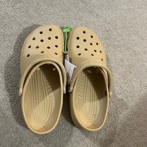 These crocs are in a size 11 womens, in the colour wheat, they havent been worn.